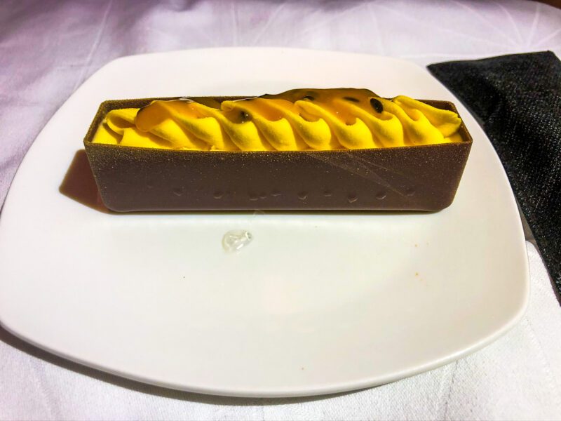 Etihad 787-9 business class passion fruit mousse dark chocolate dessert close-up