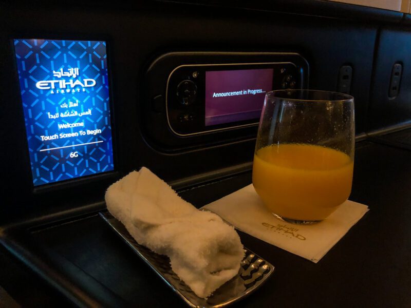 Etihad 787-9 business class welcome towel and drink