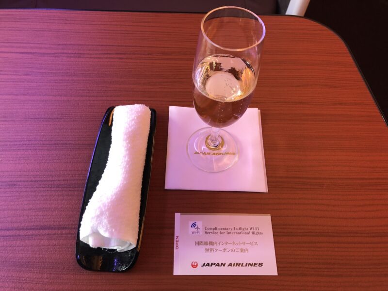 Japan Airlines First Class Welcome Drink And Hot Towel