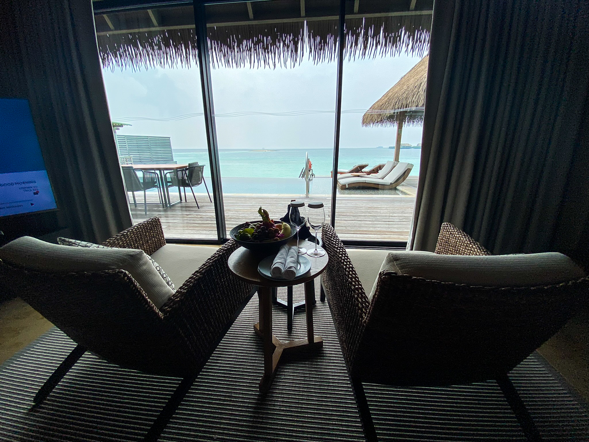 Waldorf Astoria Maldives Ithaafushi king reef villa indoor lounge chairs