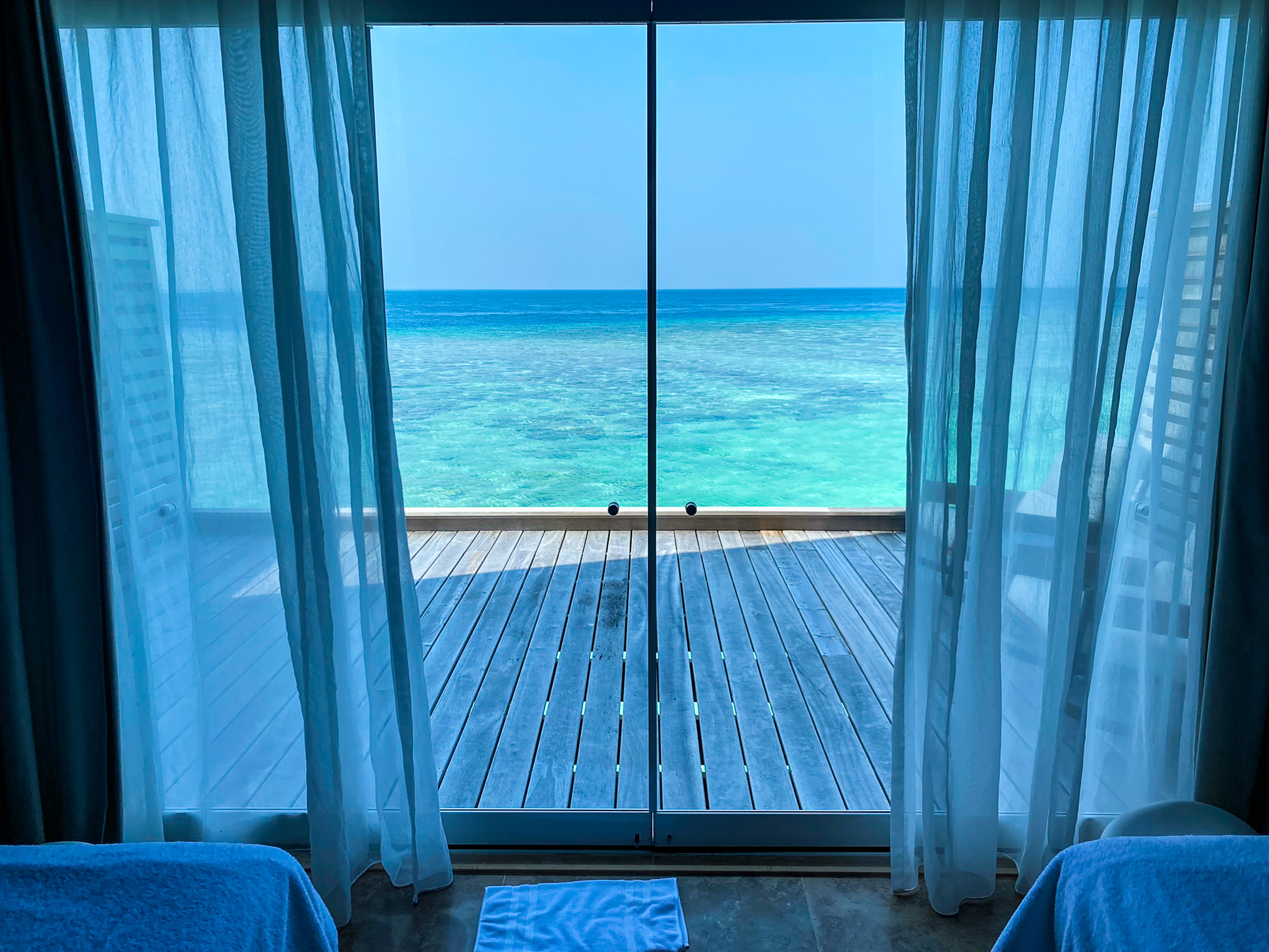 Waldorf Astoria Maldives Ithaafushi overwater spa treatment villa windows